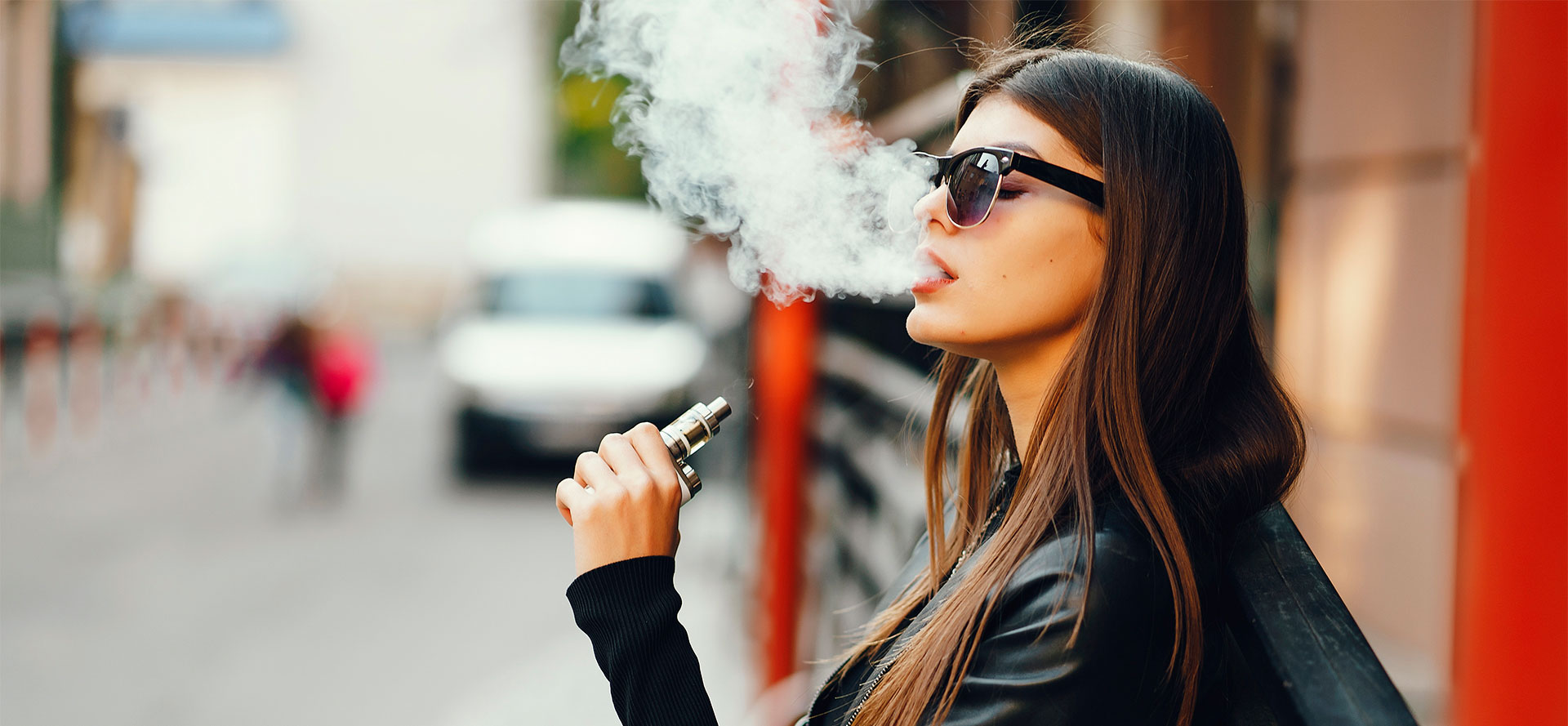 Woman smoking Full-Spectrum Cannabis Vape Juice.